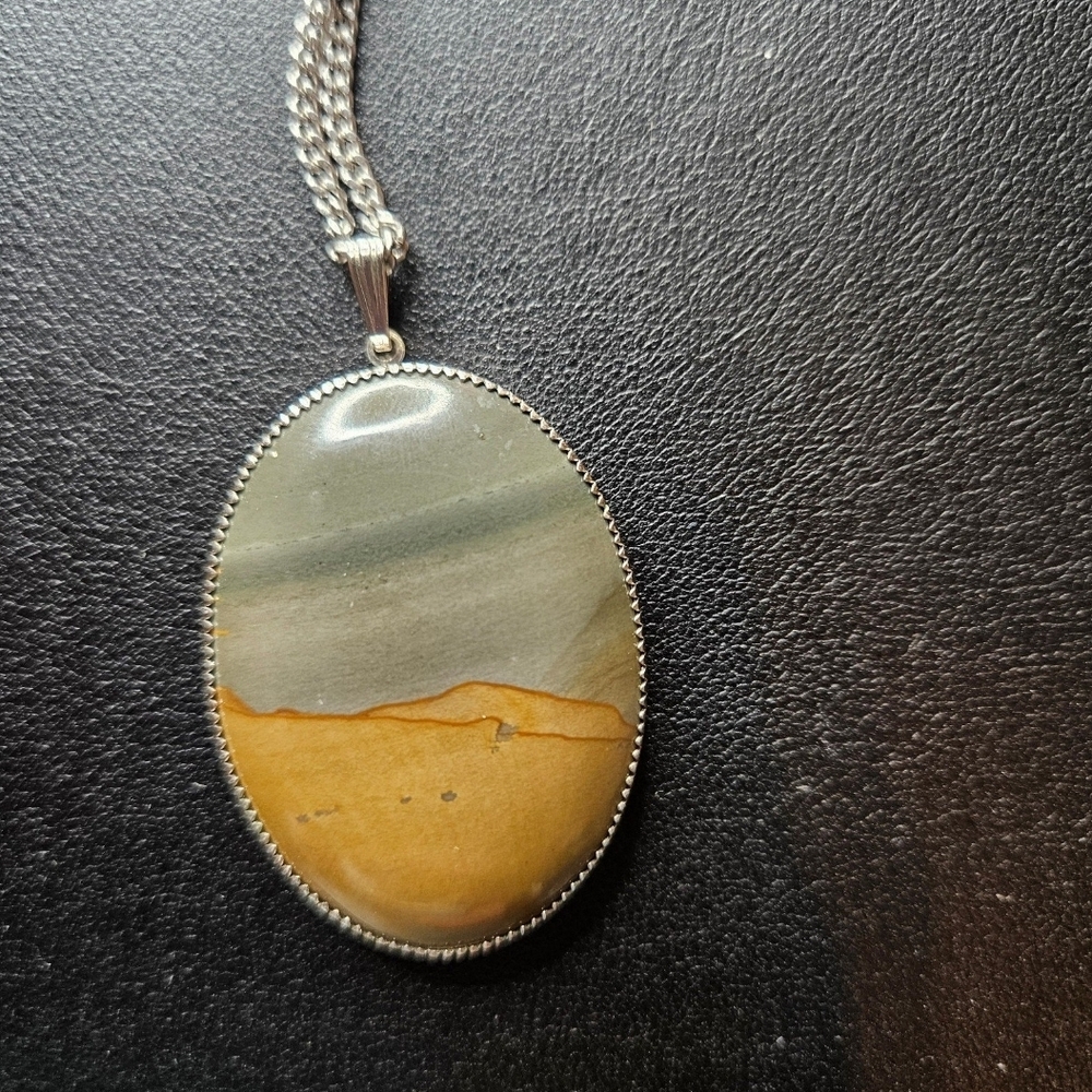 Elegant Silver and Tan Pendant Necklace